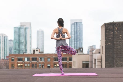 A woman doing yoga.