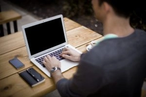 A man working on his laptop.